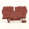 Brown ABB/industrial terminal block with mounting feet, side view showing connector slots and embossed labeling.