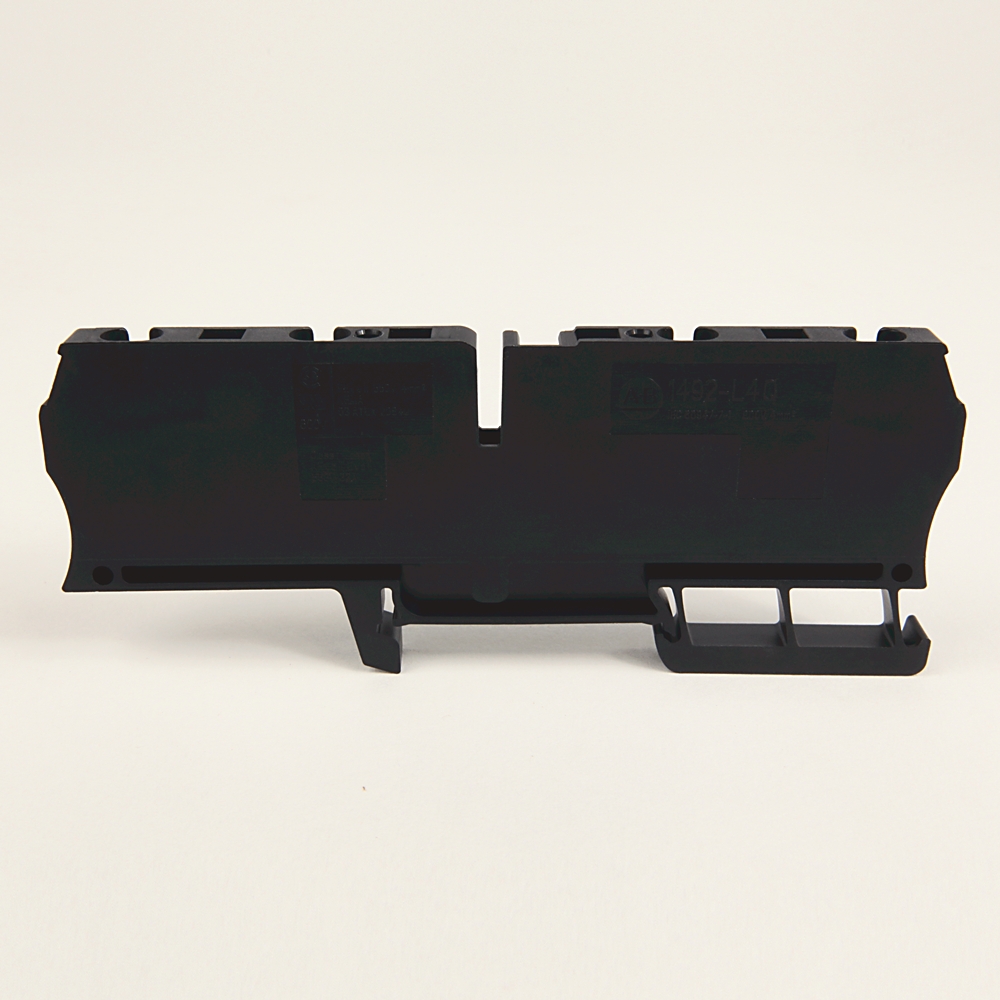 Black plastic module with mounting brackets, photographed on a white background (electrical component).