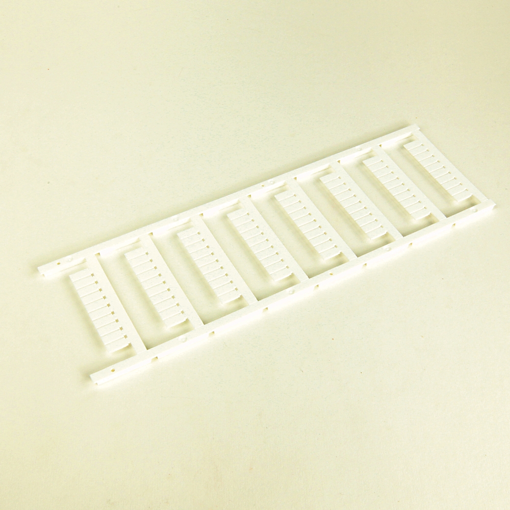 White plastic mounting frame with multiple evenly spaced comb-like slots for holding items