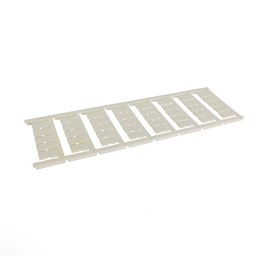 White plastic slotted rack with many rectangular slots laid on a white surface.