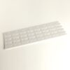 White plastic slotted panel with repeating curved rectangular openings on a light background, laid diagonally.