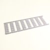 Row of identical gray plastic brackets connected along a strip, laid diagonally on a light background (likely spacers/holders). You can see repeated rectangular cutouts in each bracket piece.