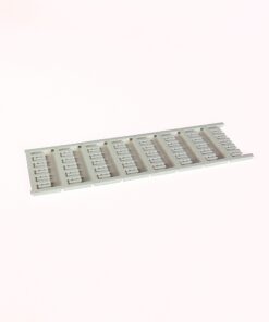 Long gray plastic slotted rack with many evenly spaced rectangular slots on a flat rail surface.