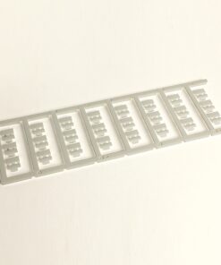 Gray plastic sprue with eight identical rectangular frames containing small cross-shaped cutouts.