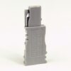 Gray modular electrical connector module standing upright on a white background, side view showing a locking mechanism on top edge and labeling on the front.