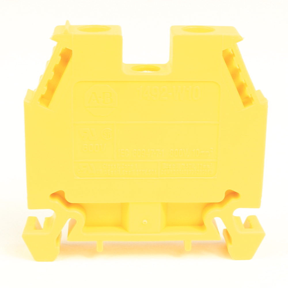 Yellow plastic electrical mounting block with side clips and terminal slots for wiring harnesses