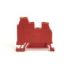 Red modular electrical terminal block with mounting feet, viewed from the side.