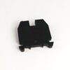 Black plastic electrical component with three bottom pins and side mounting clips, intended for PCB mounting