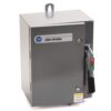Gray metal electrical enclosure with Allen-Bradley label and a side-mounted on/off switch on the right flank.