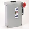 Industrial electrical disconnect enclosure with a red manual switch and ON/OFF label on the front panel, grey metal box.
