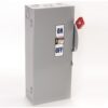 Industrial electrical disconnect switch in a gray metal box with a red handle; label shows ON/OFF and warning sticker on the door.