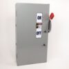 Gray electrical disconnect cabinet with ON/OFF label and a red lockable handle on the right.