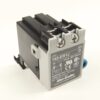 Allen-Bradley industrial relay module with gray front panel and two screw terminals labeled E1 and E2 on top side.