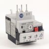 Compact Allen-Bradley timer relay with four terminal posts and a labeled Trip/Test dial used in control circuits.