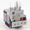 Allen-Bradley 193-T timer relay module with screw terminals and blue/red push buttons on the front plate.