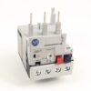 Small industrial relay block with A-B logo, label 193-T and multiple top pins for wiring, bottom screw terminals visible.