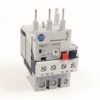 Three‑pole electrical contactor/module with terminal screws and red/blue actuator levers, used to switch high‑current circuits (AB logo visible).