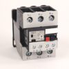 Three‑pole electrical contactor with screw terminals labeled L1–L3 on top and T1–T3 on bottom, used to switch motor power in a control circuit.
