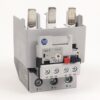 Electrical contactor/relay with three terminal blocks (T1, T2, T3) and a control switch, labeled 2,4,6 for coil connections and NO/NC contacts.