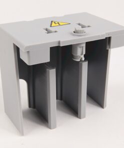 Grey plastic electrical terminal block with three vertical slots and a caution label on top in a small enclosure.