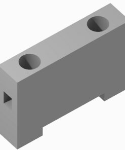 Isometric view of a gray rectangular block with two circular holes on the top face and a small notch on the left front edge.